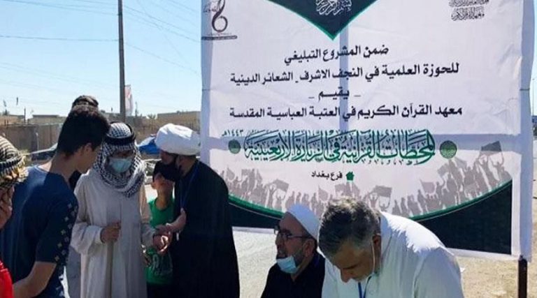 بالصور من مسيرة الأربعين الحسيني.. محطات تعليم القرآن للزوّار تفتح أبوابها في بغداد